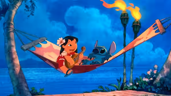 Lilo plays ukulele beside Stitch in a hammock by the ocean