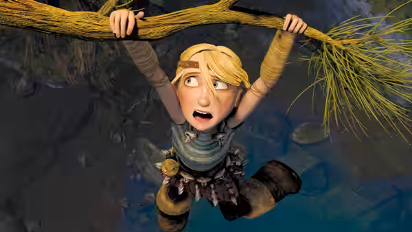 Astrid (America Ferrera) hanging from a tree branch looking down