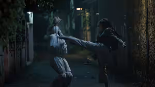 A person kicks a bundled figure along a dim, narrow alley