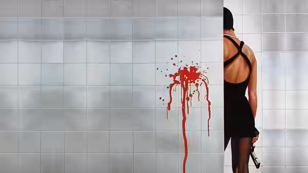 Nikita (Anne Parillaud) holding a gun behind a wall with blood splatter