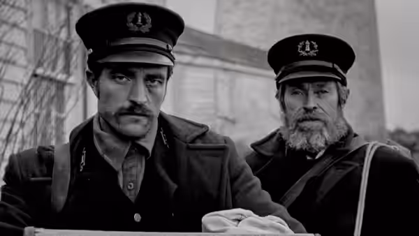 Thomas Howard (Robert Pattinson) and Thomas Wake (Willem Dafoe) in naval uniforms