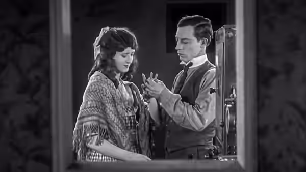 Buster Keaton and Kathryn McGuire facing each other closely