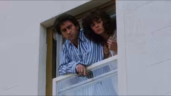 Gordon Urquhart (Denis Lawson) and Stella Urquhart (Jennifer Black) leaning from an open window