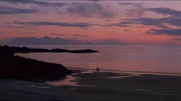 Two distant figures walking on a wide beach at twilight