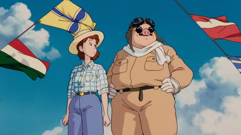 Fio Piccolo and Porco Rosso standing side by side beneath fluttering signal flags