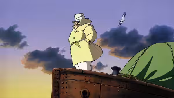 Porco Rosso in a yellow coat standing on a ship's deck at dusk