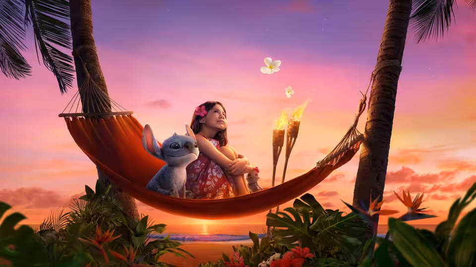 Lilo (Maia Kealoha) and Stitch relaxing together in a hammock at sunset