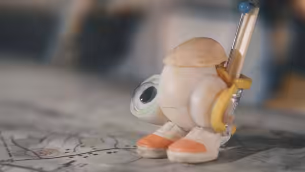 Marcel carrying a pen strapped to its back like a pack