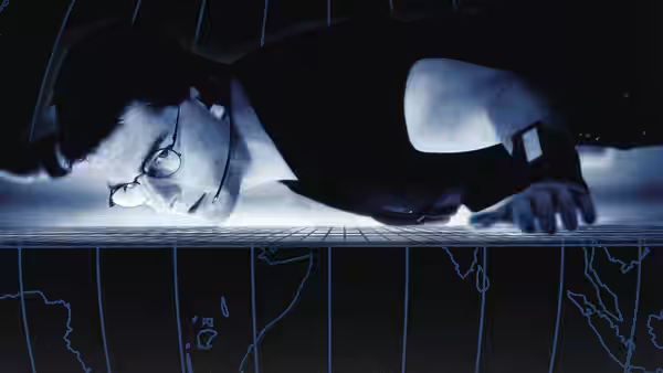 Ethan Hunt (Tom Cruise) lying prone on a surface with a glowing world map projection