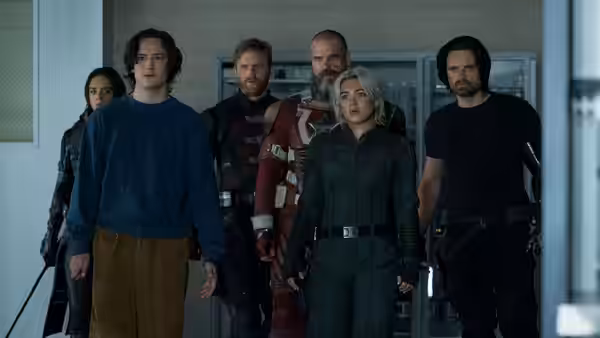 Yelena (Florence Pugh) leading a group of allies down an office corridor