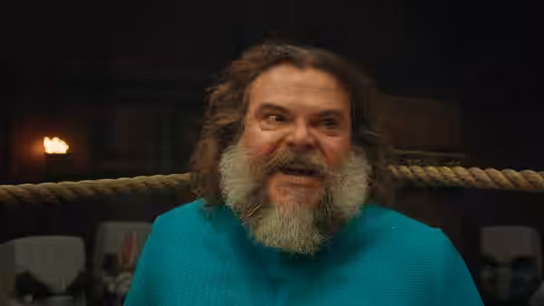 Garrett (Jason Momoa) shouting intensely inside a wooden boxing ring