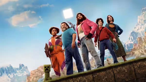 Steve (Jack Black) and Garrett (Jason Momoa) with companions overlooking a mountainous landscape