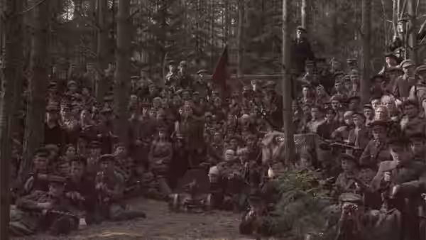 A large crowd of partisans gathered in a forest clearing