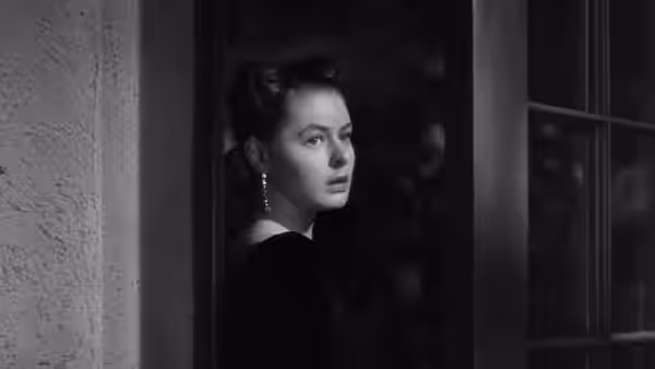 Alicia Huberman (Ingrid Bergman) peering from a doorway at night