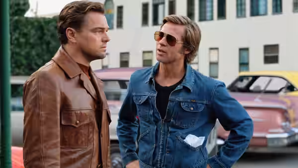 Rick Dalton (Leonardo DiCaprio) and Cliff Booth (Brad Pitt) standing on a street
