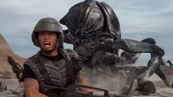 Johnny Rico (Casper Van Dien) shouting as a giant bug looms over him