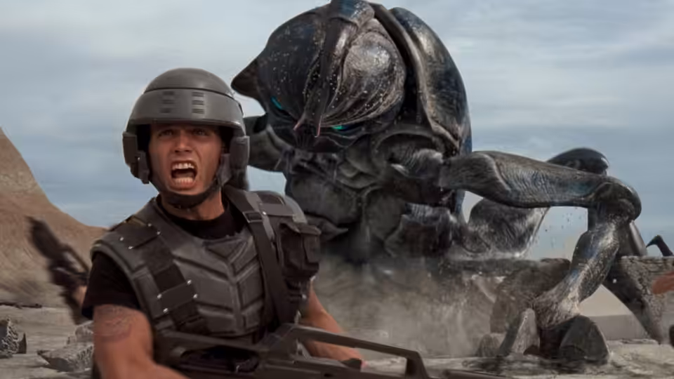 Johnny Rico (Casper Van Dien) shouting as a giant bug looms over him