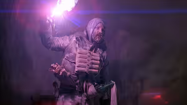 MacReady (Kurt Russell) raising a bright flare in a dark icy cave