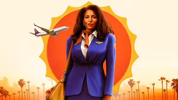 Jackie Brown (Pam Grier) standing in uniform beside a flying airplane