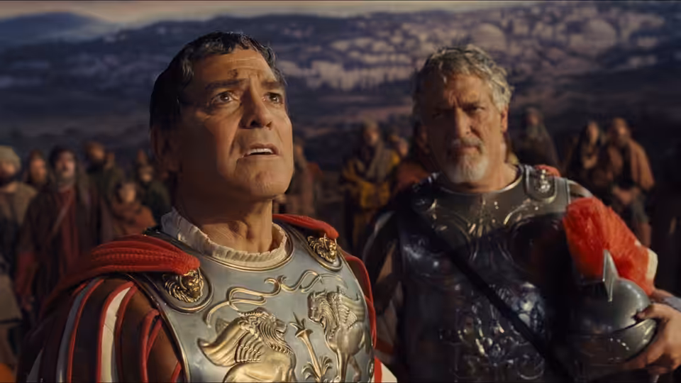 Baird Whitlock (George Clooney) in Roman armor stands beside another soldier