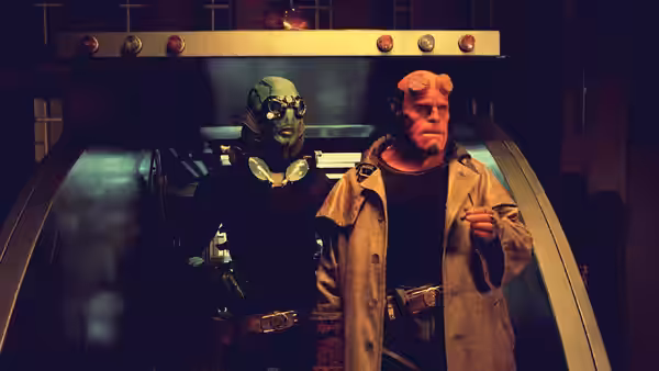 Abe Sapien (Doug Jones) and Hellboy (Ron Perlman) standing inside a tunnel