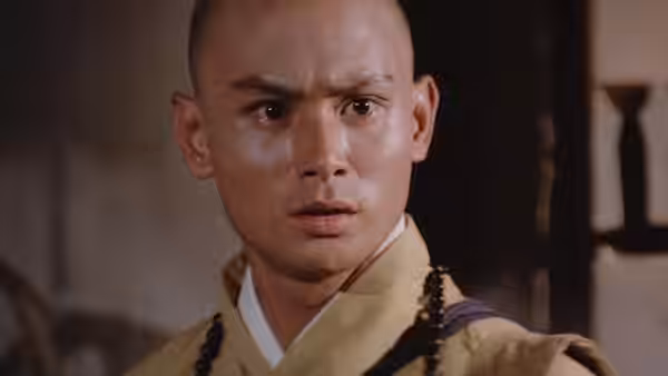 Liu Yu-de (Gordon Liu) stares ahead in his monk's robes