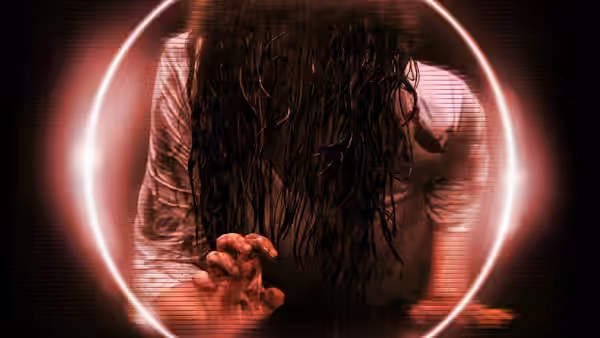 A long-haired figure reaches through a glowing television screen