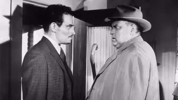 Ramon Vargas (Charlton Heston) faces Captain Quinlan (Orson Welles) in a doorway