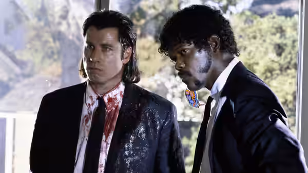 Vincent Vega (John Travolta) and Jules Winnfield (Samuel L. Jackson) covered in blood