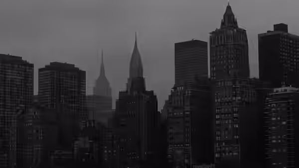 New York City skyline featuring skyscrapers and the Chrysler Building at dusk