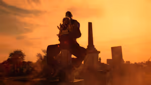 Two figures struggling on a gravestone in a cemetery at sunset