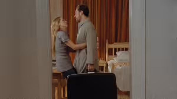 Marianne (Liv Ullmann) and Johan (Erland Josephson) stand together in a doorway