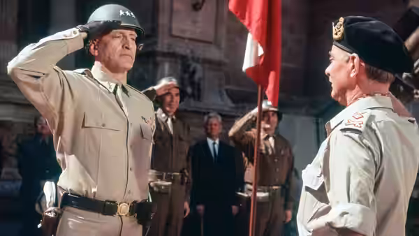 General Bradley saluting while facing another officer outdoors