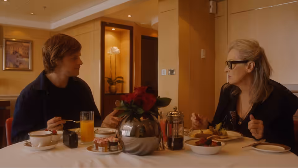 Tyler Hughes (Lucas Hedges) and Alice Hughes (Meryl Streep) at breakfast