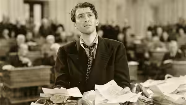 Jefferson Smith (James Stewart) at his cluttered desk in the Senate chamber