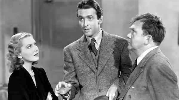 Clarissa Saunders (Jean Arthur) and Jefferson Smith (James Stewart) with a colleague