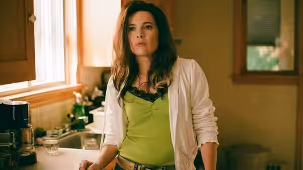 Diane (Anne Dorval) standing in a kitchen looking to the side