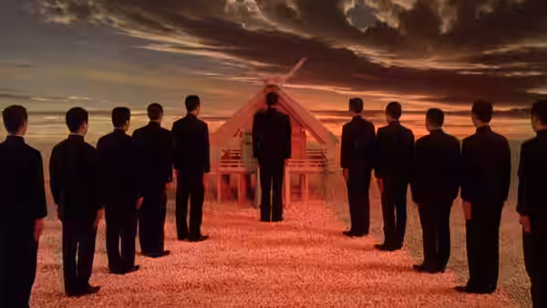 men in black suits form a circle around a small wooden structure on red earth at sunset