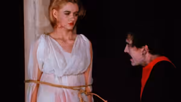 The Master shouts at a woman tied to a pillar