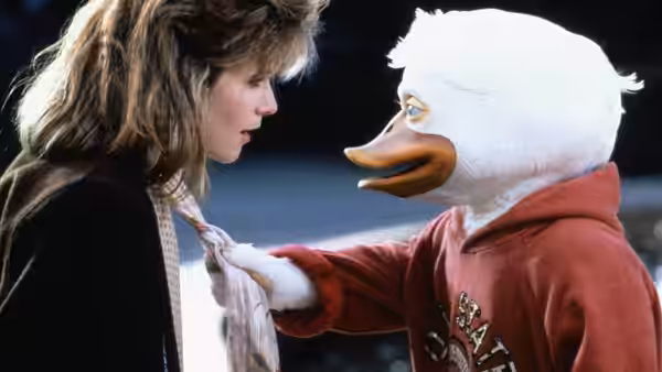 Beverly Switzler (Lea Thompson) faces Howard the Duck in a red hoodie