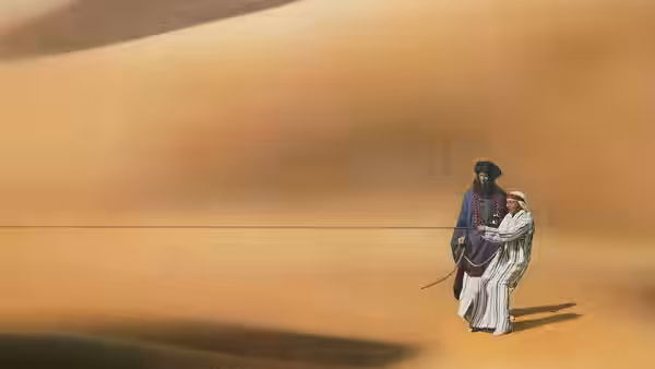Two men walking across the desert sand at sunset tied together