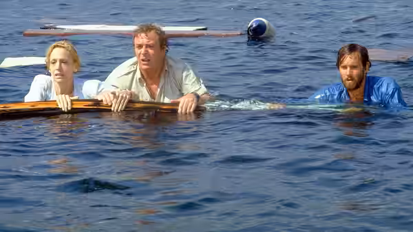 Ellen Brody (Lorraine Gary) and two men clinging to floating wreckage