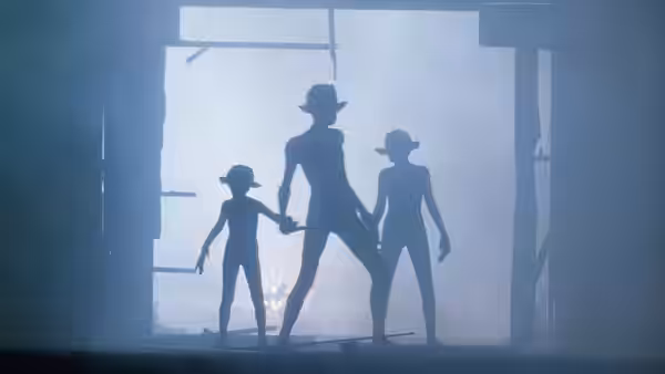 Three small alien figures stand silhouetted in a large doorway