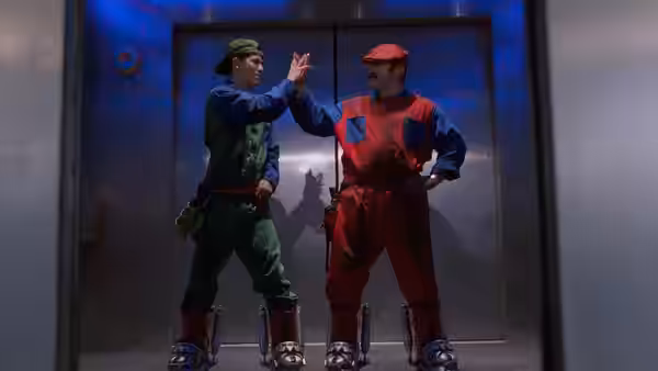 Mario and Luigi high-fiving in front of elevator doors