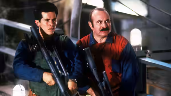 Mario and Luigi holding large weapons in an industrial corridor