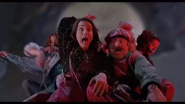A terrified woman and surprised man clinging together on a ride