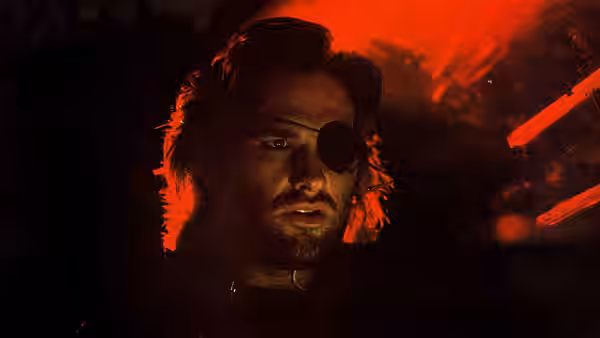 Snake Plissken (Kurt Russell) looks ahead beneath red light