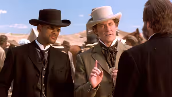 Capt. James West (Will Smith) and Artemus Gordon (Kevin Kline) talking outdoors in hats