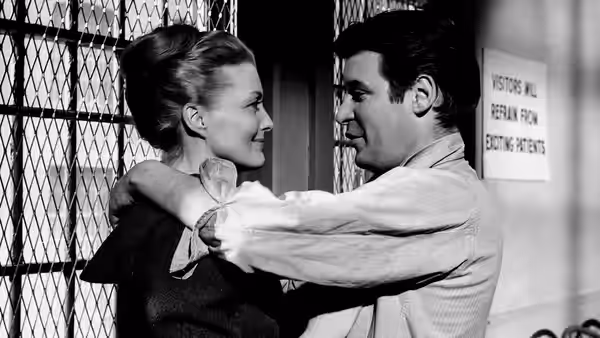 Johnny Barrett (Peter Breck) embraces Cathy (Constance Towers) in a hospital corridor