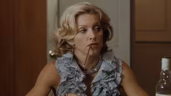 Amber Leighton (Madonna) holds a pencil between her lips